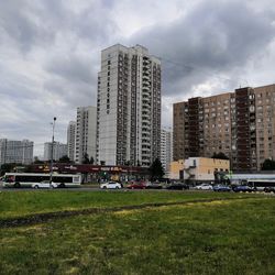 Modern buildings in city against sky