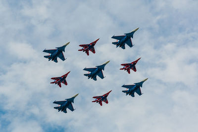 Low angle view of airshow in sky