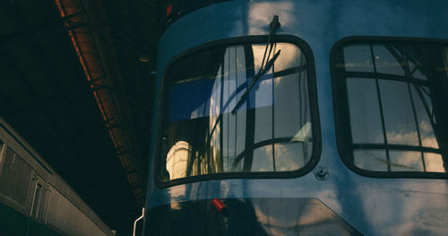 Reflection of train on glass window