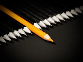 High angle view of pencils on black background