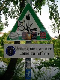 Low angle view of information sign against sky