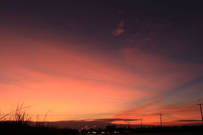 Silhouette landscape against sky during sunset