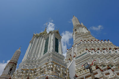 Low angle view of buildings against blue sky