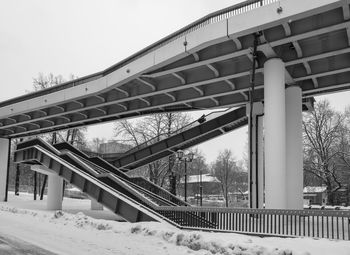 Low angle view of bridge against sky during winter