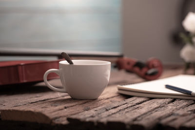 Close-up of coffee cup on table