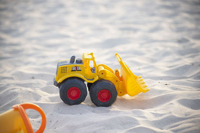 Close-up of toy car on sand