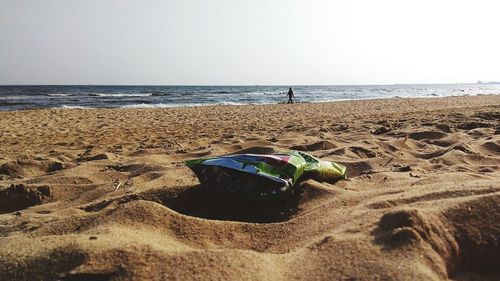 Scenic view of beach against clear sky