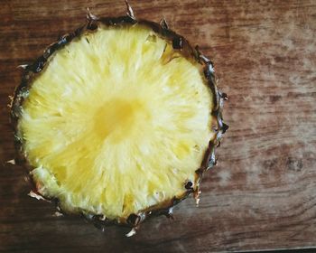 Close-up of lemons on wood
