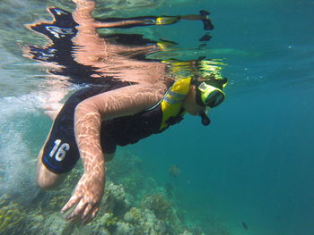 Boy diving undersea