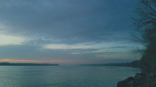 Scenic view of sea against sky at sunset