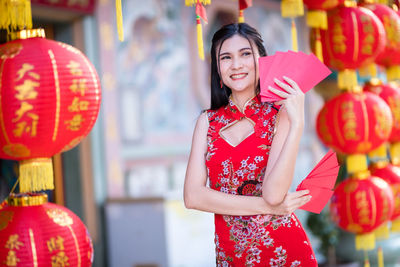 Portrait of smiling young woman in traditional clothing