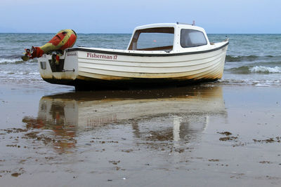 Boats moored in sea