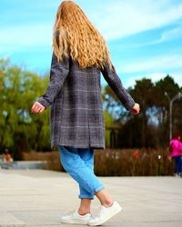 Rear view of woman walking outdoors