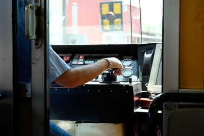 Cropped image of man in vehicle