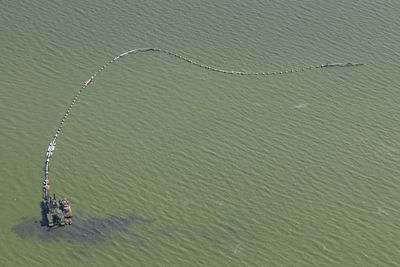 Aerial view of oil rig polluted dian lake