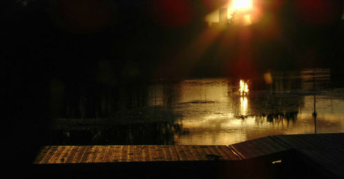 Reflection of trees in water at night