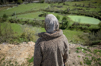 Rear view of man on field