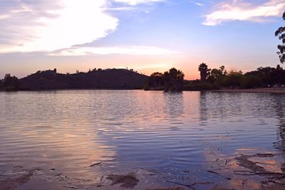 Scenic view of lake against sky during sunset