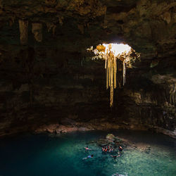 Scenic view of cenote through cave