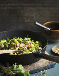 Brussels sprouts with bacon on frying pan