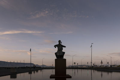 Statue of liberty against sky during sunset