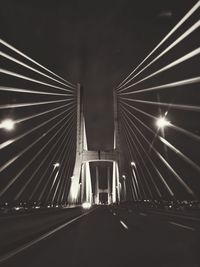 Low angle view of suspension bridge at night