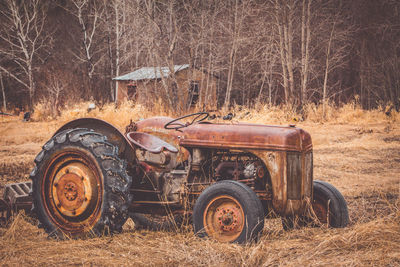 Abandoned tractor on field