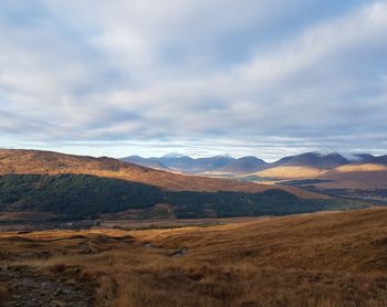 Scenic view of landscape and mountains against sky