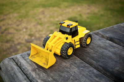 High angle view of yellow toy car on table