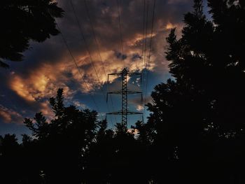 Low angle view of silhouette trees against sky during sunset