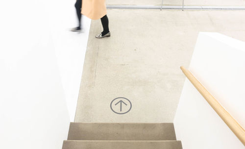 Low section of woman walking in national museum of modern and contemporary art