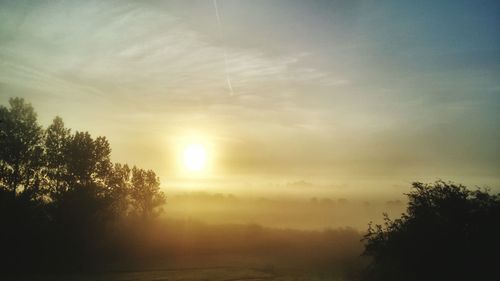 Scenic view of landscape at sunset