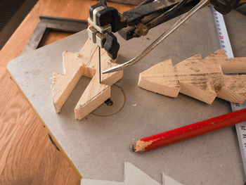 High angle view of wooden christmas tree and equipment