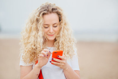 Young woman using mobile phone