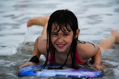 Portrait of a smiling girl in sea