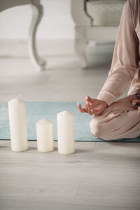 Midsection of woman on table at home