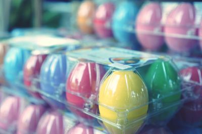 Close-up of multi colored candies in glass on table