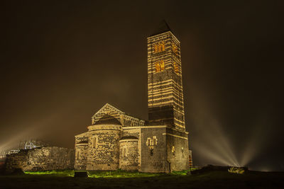 Illuminated tower in city at night