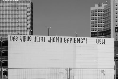 Information sign against buildings in city