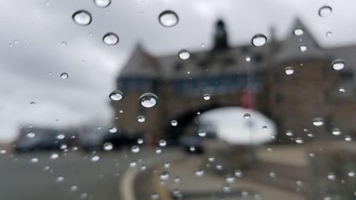 Full frame shot of wet glass window in rainy season