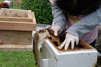 Low section of man working on wood