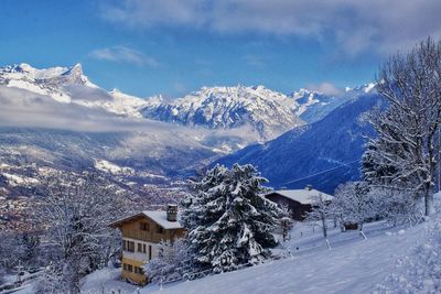 Scenic view of snowcapped mountains against sky