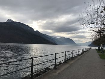 Scenic view of sea and mountains against sky