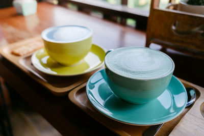 High angle view of coffee served on table