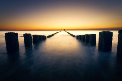 Scenic view of sea against clear sky during sunset