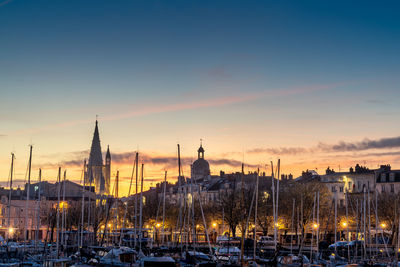 Panoramic view of the old harbor of la rochelle at blue hour with its famous old towers