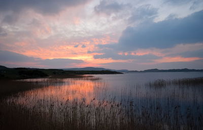 Scenic view of lake against sky during sunset