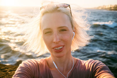 Portrait of young woman on shore