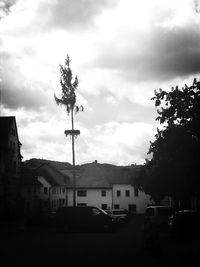 Buildings against cloudy sky