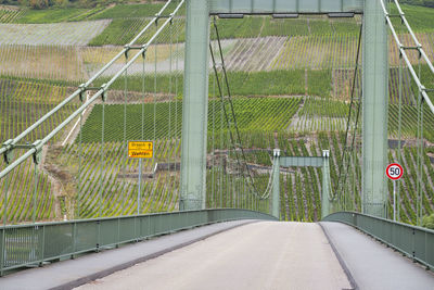 Road amidst fence